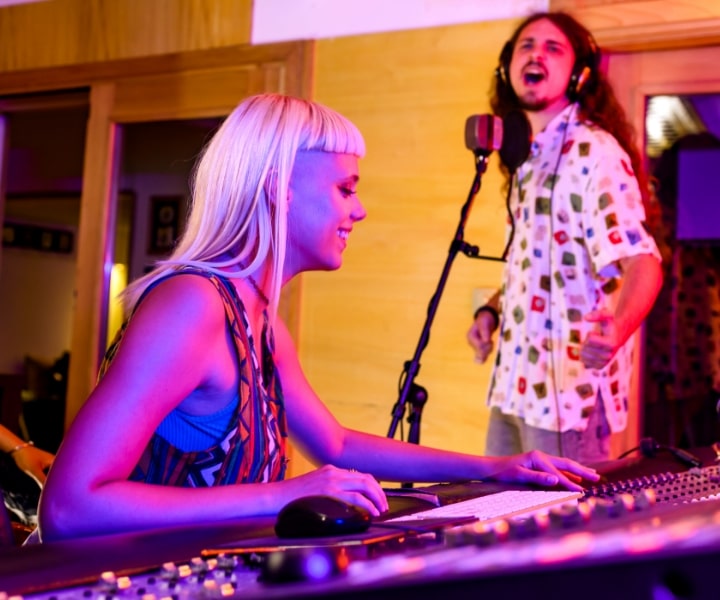 Singer and sound engineer mixing
